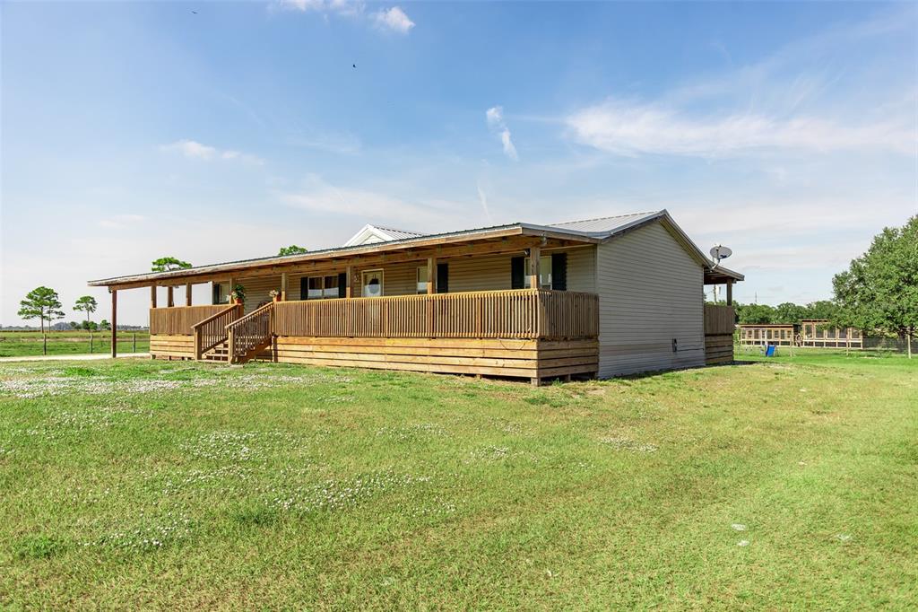 1075 Southwest Rucks Dairy Road Okeechobee, FL 34974 - Photo 20 of 65 a view of a house with backyard