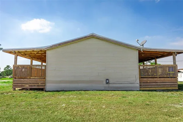 a view of back yard of a house