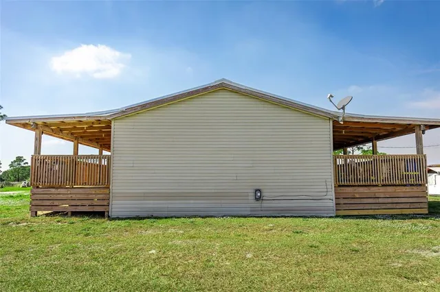 a view of back yard of a house