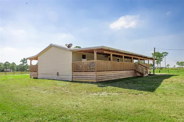 a view of a porch with wooden floor