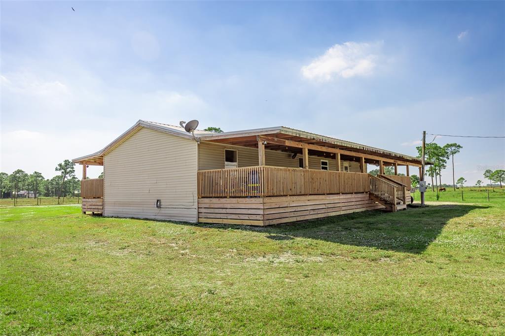 1075 Southwest Rucks Dairy Road Okeechobee, FL 34974 - Photo 22 of 65 a view of a house with a yard