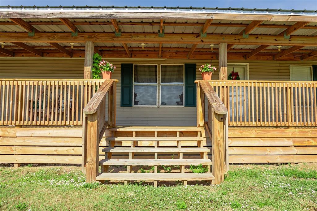 1075 Southwest Rucks Dairy Road Okeechobee, FL 34974 - Photo 29 of 65 a front view of a house with a window