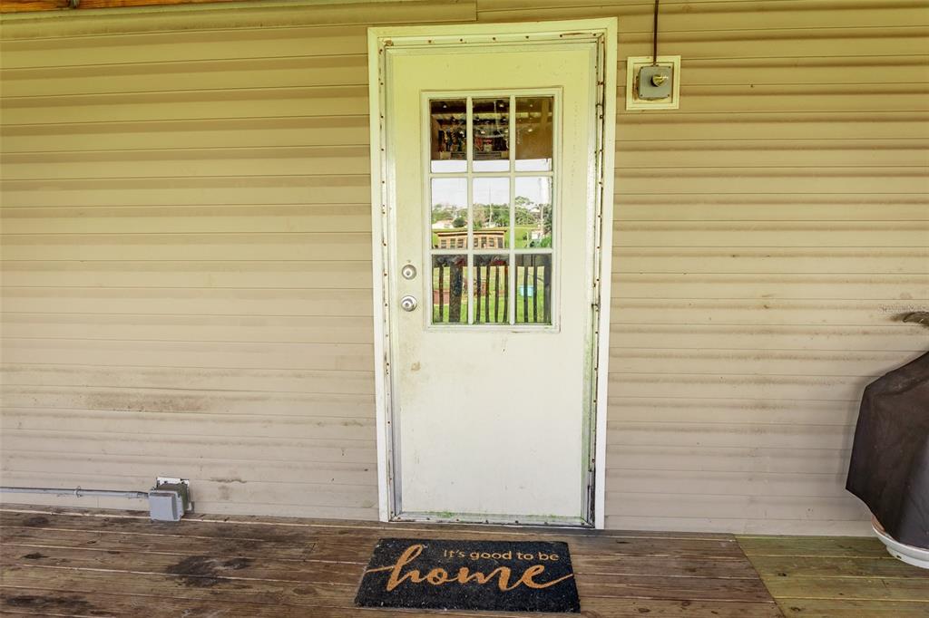 1075 Southwest Rucks Dairy Road Okeechobee, FL 34974 - Photo 36 of 65 a view of a door of the house