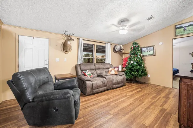 a bedroom with bed and flat screen tv