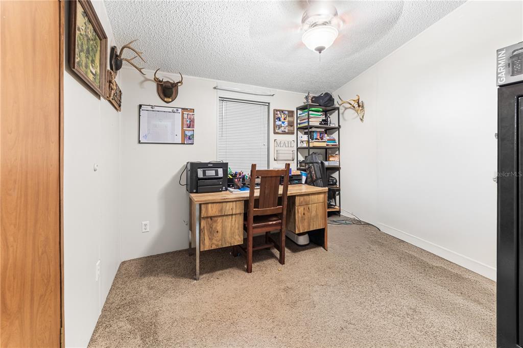 1075 Southwest Rucks Dairy Road Okeechobee, FL 34974 - Photo 61 of 65 a view of a workspace with furniture