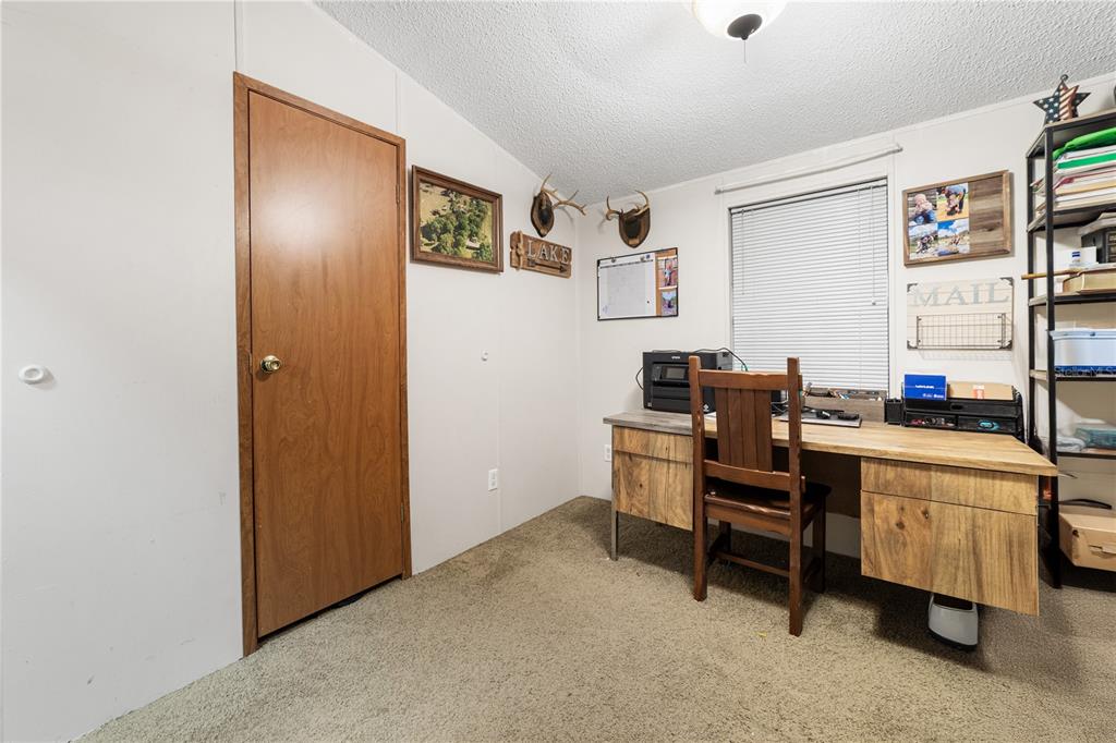 1075 Southwest Rucks Dairy Road Okeechobee, FL 34974 - Photo 62 of 65 a workspace with furniture and window