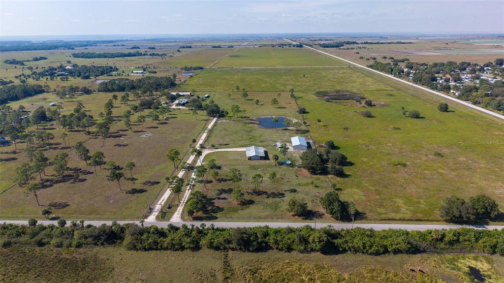 1075 Southwest Rucks Dairy Road Okeechobee, FL 34974 - Photo 7 of 65 an aerial view of ocean and residential houses with outdoor space