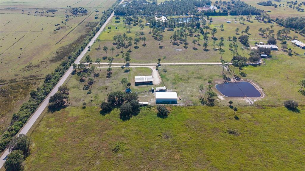 1075 Southwest Rucks Dairy Road Okeechobee, FL 34974 - Photo 9 of 65 a aerial view of a house with a garden