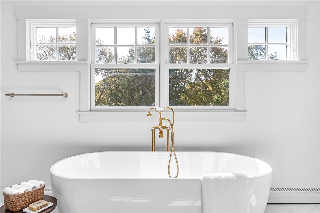 229 Saugatucket Road South Kingstown, RI 02879 - Photo 24 of 48 Your bath awaits in all day sun. Soaking tub made by Mokleba. Walk-in shower features polished gold fixtures by Brizo. Heated marble floors.