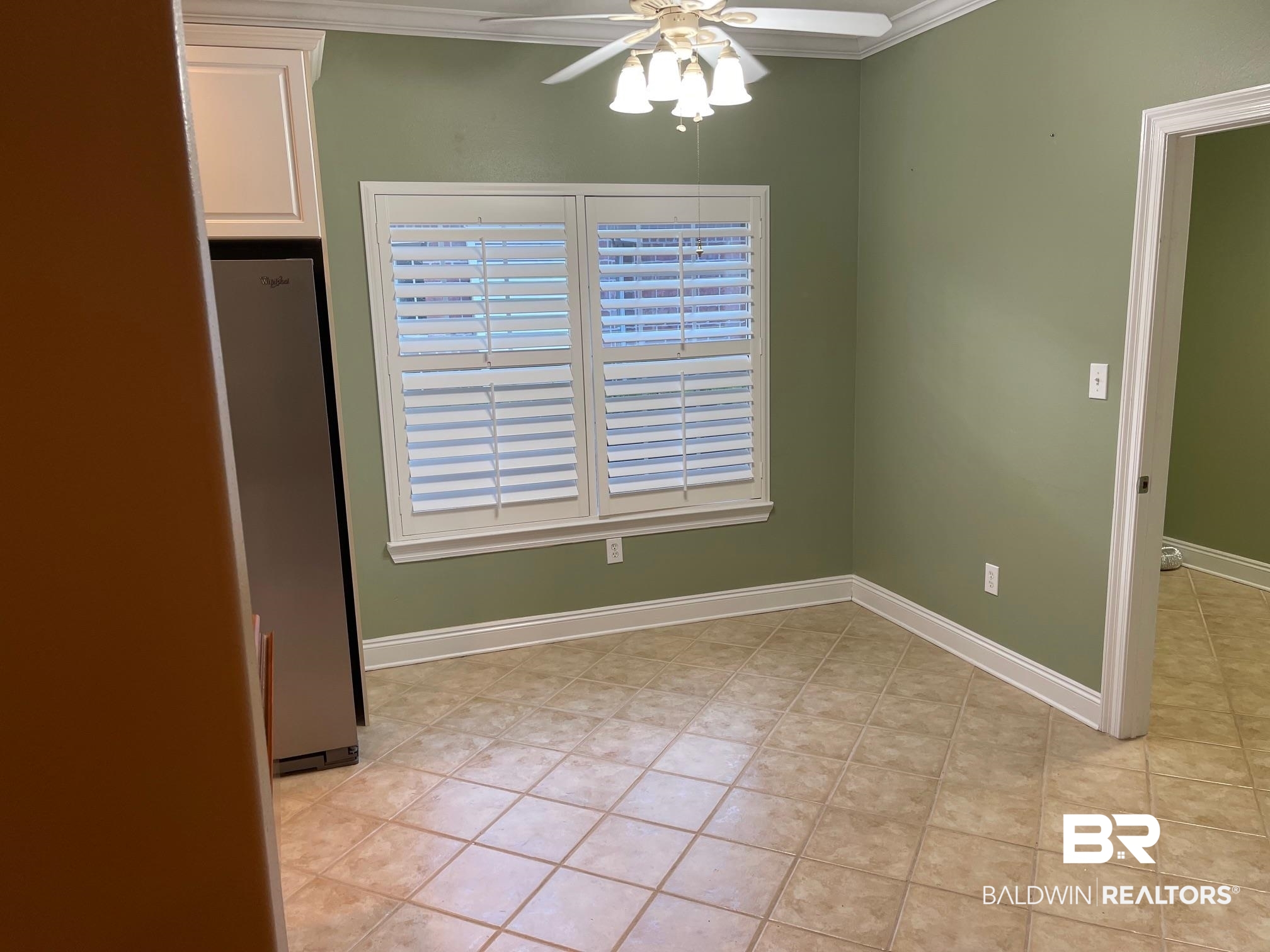 109 Savannah Circle Foley, AL 36535 - Photo 8 of 17 Unfurnished dining area featuring ceiling fan, light tile patterned floors, and ornamental molding
