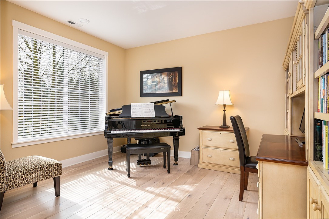 3909 219th Street Southeast Bothell, WA 98021 - Photo 2 of 34 a workspace with furniture and a window