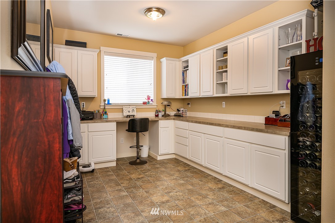 3909 219th Street Southeast Bothell, WA 98021 - Photo 12 of 34 a kitchen with a stove a sink and a refrigerator