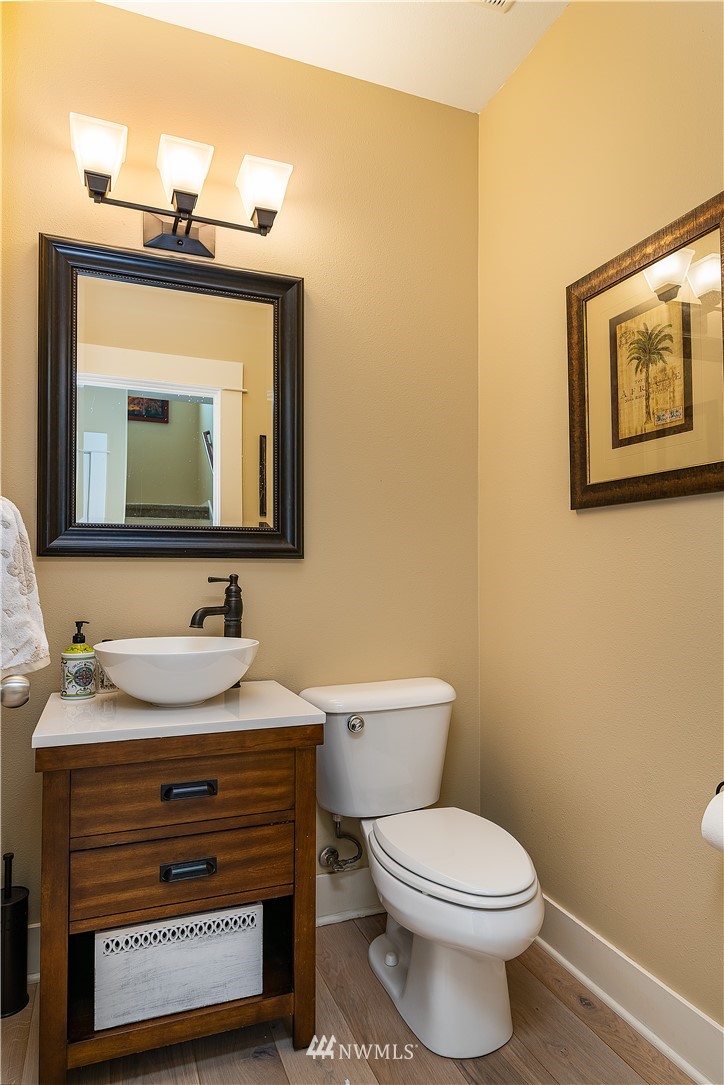 3909 219th Street Southeast Bothell, WA 98021 - Photo 14 of 34 a bathroom with a toilet sink and mirror