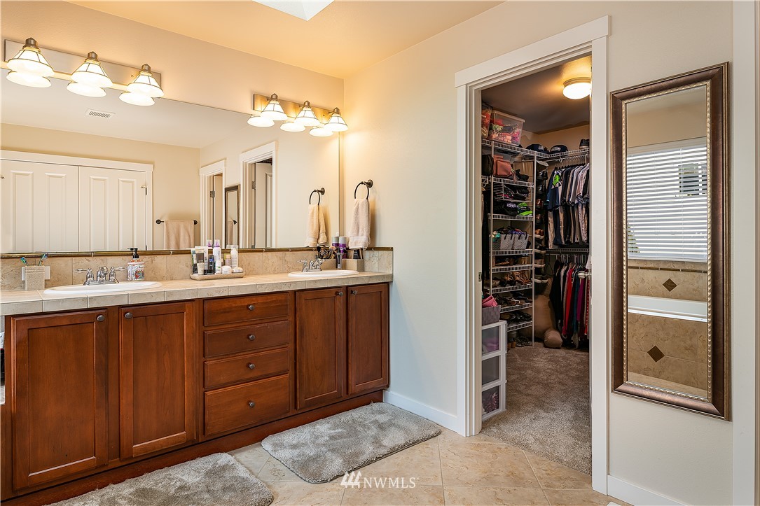 3909 219th Street Southeast Bothell, WA 98021 - Photo 20 of 34 a bathroom with a double vanity sink and a mirror