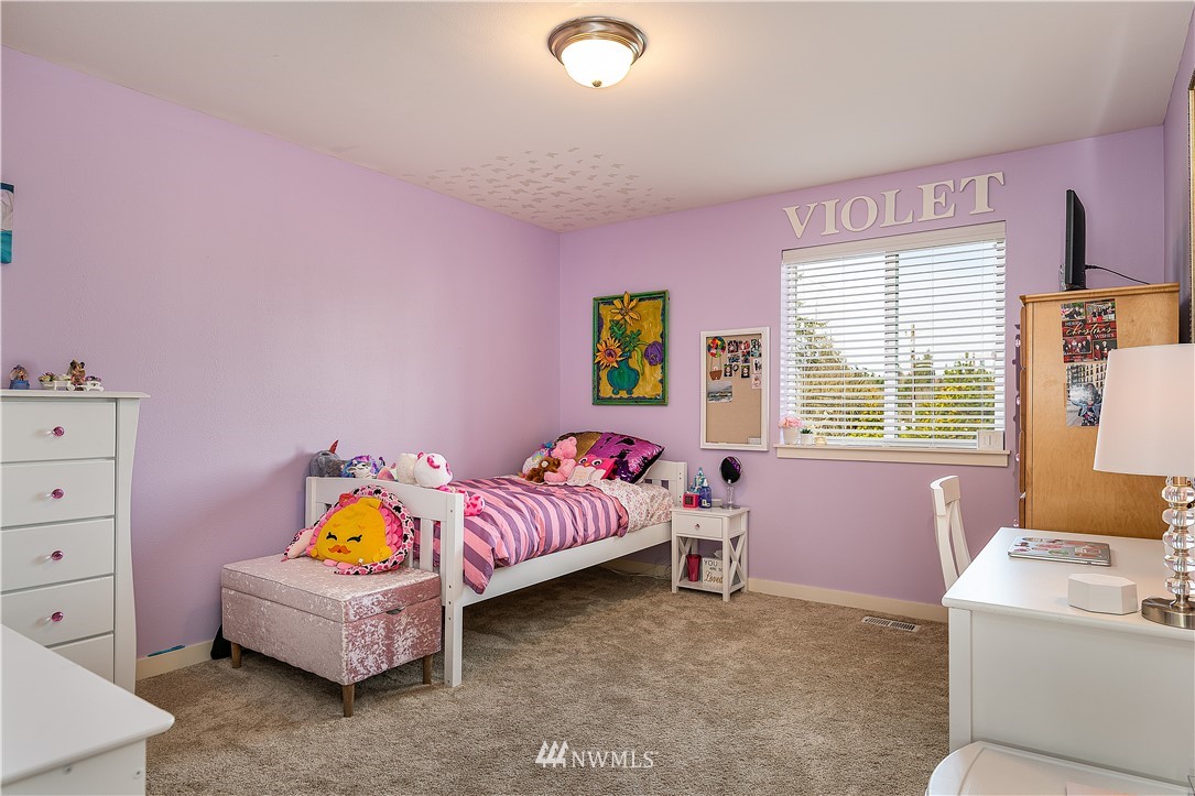 3909 219th Street Southeast Bothell, WA 98021 - Photo 21 of 34 a bedroom with a bed and a window