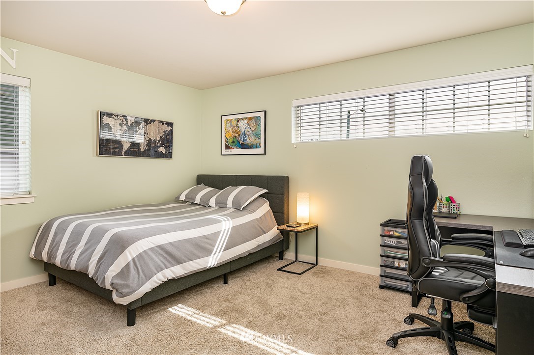 3909 219th Street Southeast Bothell, WA 98021 - Photo 23 of 34 a bedroom with a bed and a desk