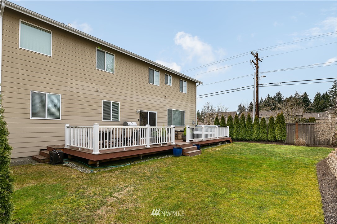 3909 219th Street Southeast Bothell, WA 98021 - Photo 26 of 34 a front view of a house with a yard table and chairs