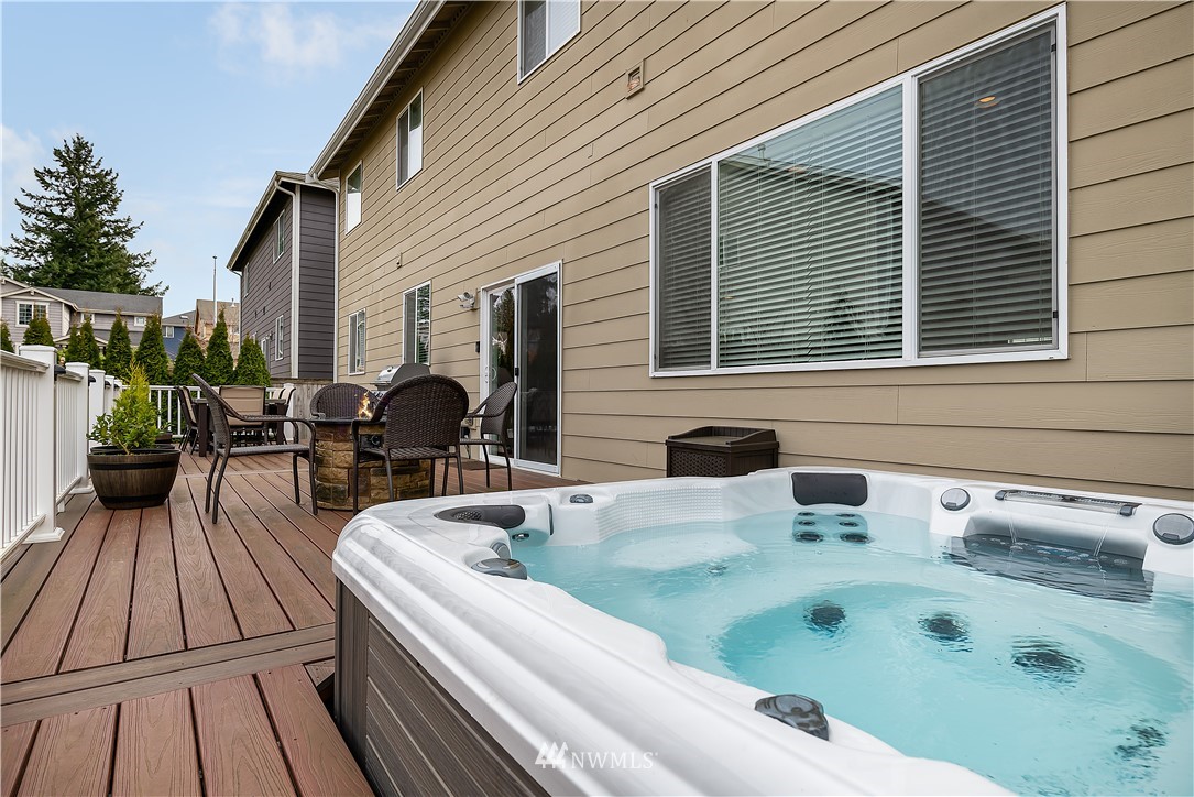 3909 219th Street Southeast Bothell, WA 98021 - Photo 28 of 34 a view of a patio with couches table and chairs with wooden floor and fence