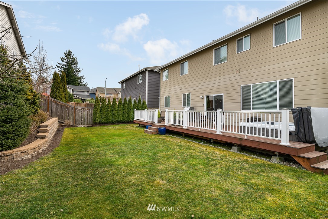 3909 219th Street Southeast Bothell, WA 98021 - Photo 29 of 34 a view of a house with a backyard and deck