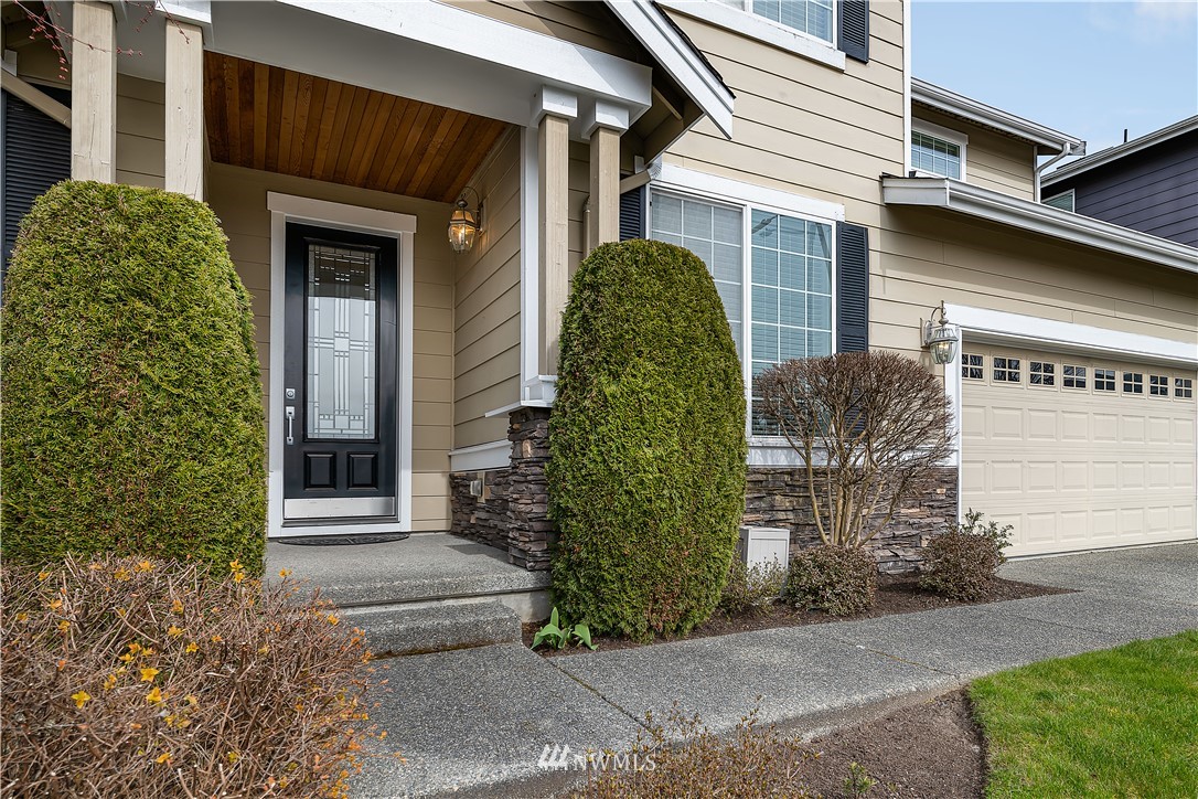 3909 219th Street Southeast Bothell, WA 98021 - Photo 32 of 34 a front view of a house with garden