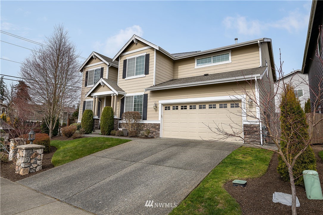 3909 219th Street Southeast Bothell, WA 98021 - Photo 34 of 34 a view of a house with a yard and garage