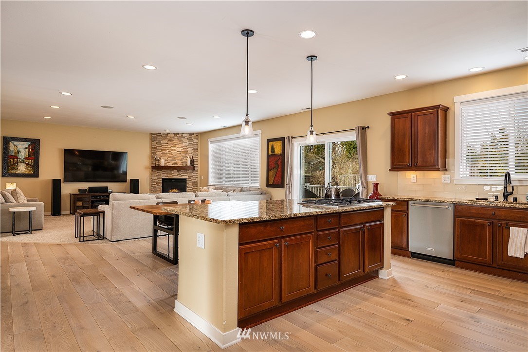 3909 219th Street Southeast Bothell, WA 98021 - Photo 6 of 34 a kitchen with a sink stove and wooden floor