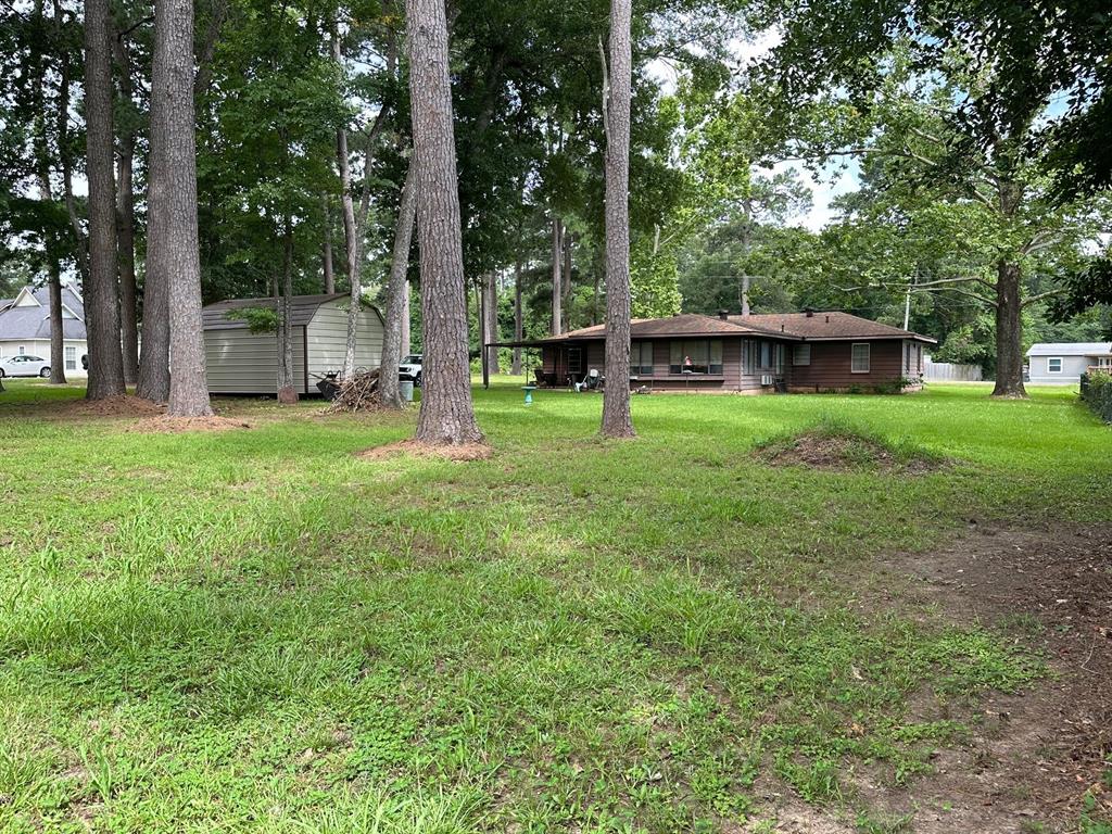 6371 Buncombe Road Shreveport, LA 71129 - Photo 8 of 17 a view of a house with backyard and a tree