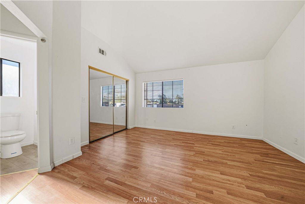 483 Violet Avenue Nipomo, CA 93444 - Photo 17 of 47 a view of an empty room with a window and wooden floor