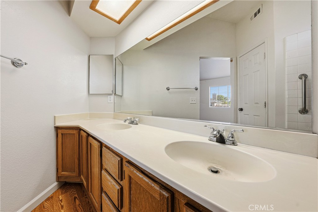 483 Violet Avenue Nipomo, CA 93444 - Photo 20 of 47 a bathroom with a sink and a mirror