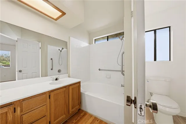 a view of a room with wooden floor and closet