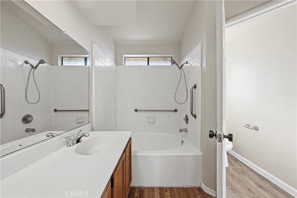 483 Violet Avenue Nipomo, CA 93444 - Photo 22 of 47 a bathroom with a tub sink shower and mirror