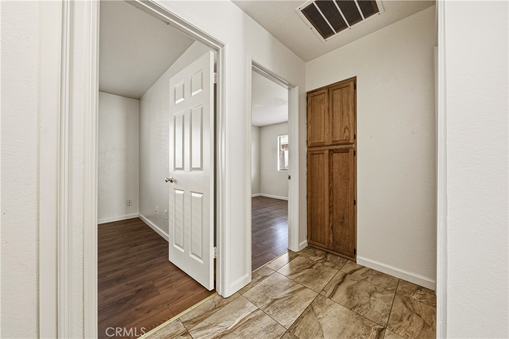 483 Violet Avenue Nipomo, CA 93444 - Photo 26 of 47 a view of a hallway with wooden floor and closet
