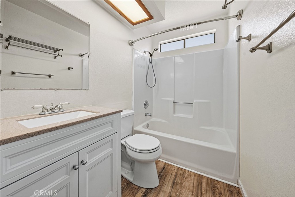 483 Violet Avenue Nipomo, CA 93444 - Photo 27 of 47 a bathroom with a granite countertop sink toilet and shower