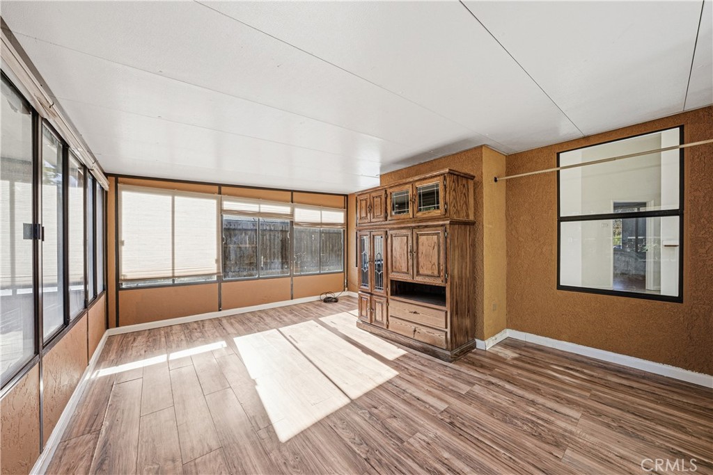483 Violet Avenue Nipomo, CA 93444 - Photo 30 of 47 a room with wooden floor and windows