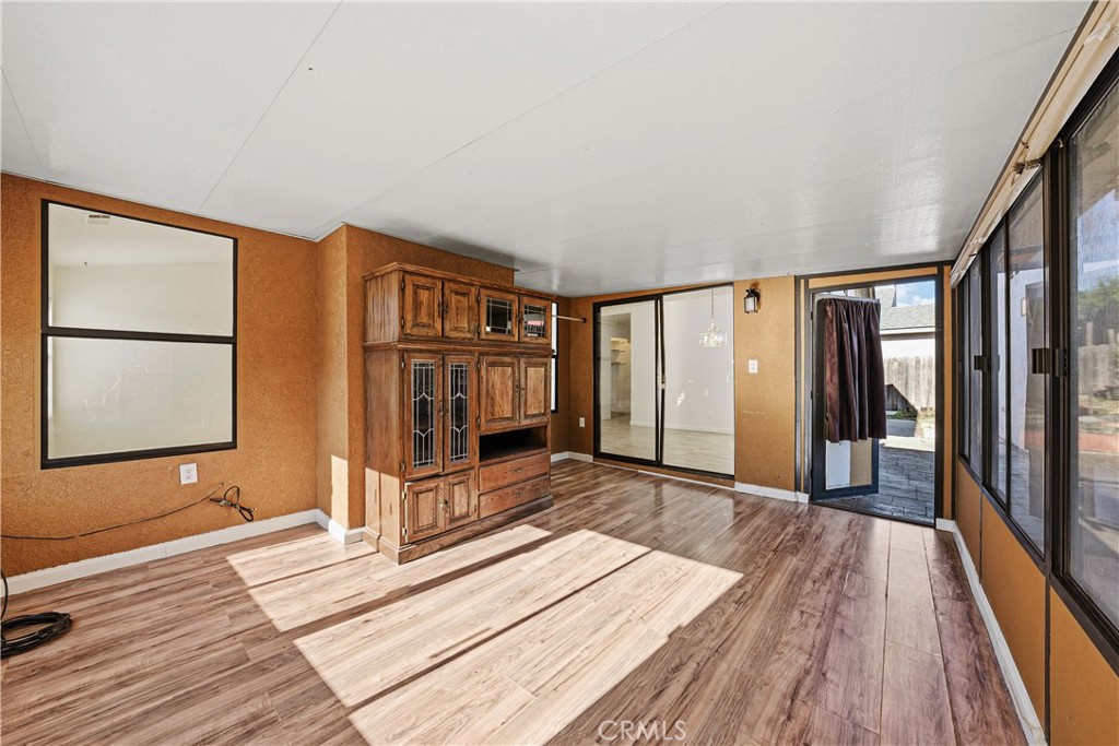 483 Violet Avenue Nipomo, CA 93444 - Photo 31 of 47 a view of an empty room with wooden floor and a window