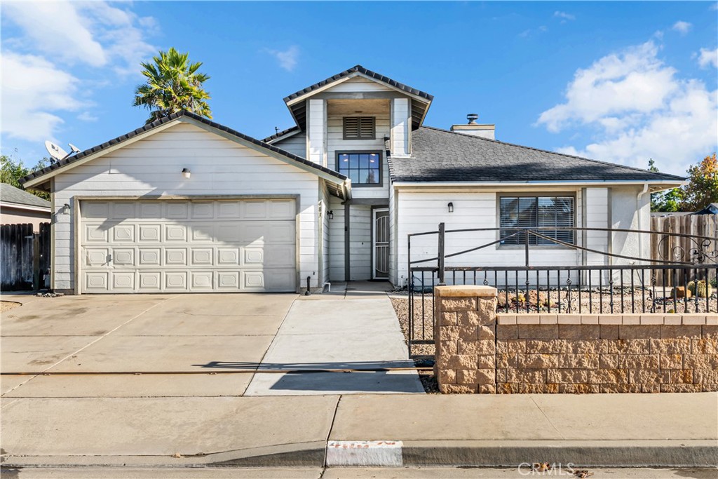 483 Violet Avenue Nipomo, CA 93444 - Photo 47 of 47 a front view of a house with a yard