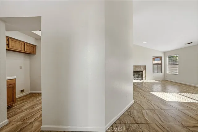 a kitchen with stainless steel appliances kitchen island granite countertop a sink and cabinets
