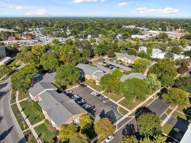 an aerial view of residential houses with outdoor space