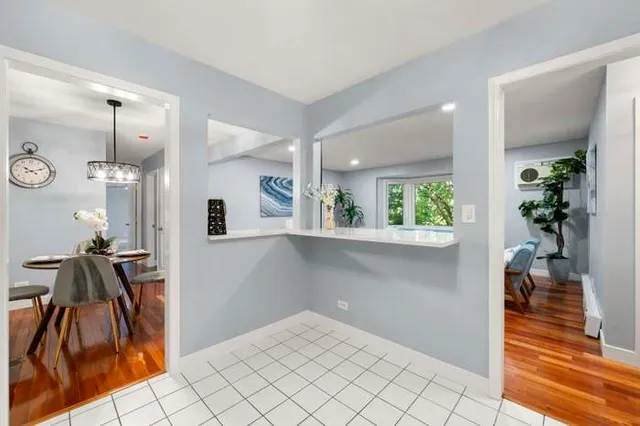 a view of hallway with wooden floor