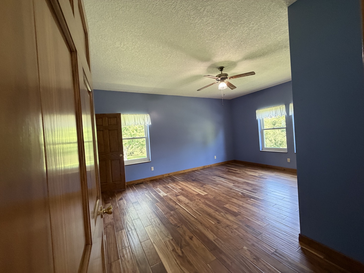 18760 Hillside Road Morrison, IL 61270 - Photo 12 of 36 wooden floor in an empty room with a window