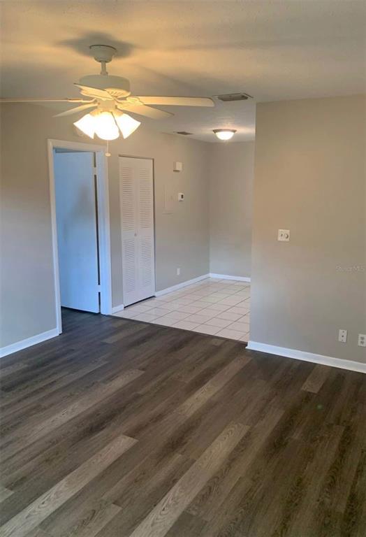 1025 Apollo Beach Boulevard, Unit B Apollo Beach, FL 33572 - Photo 6 of 8 wooden floor in an empty room