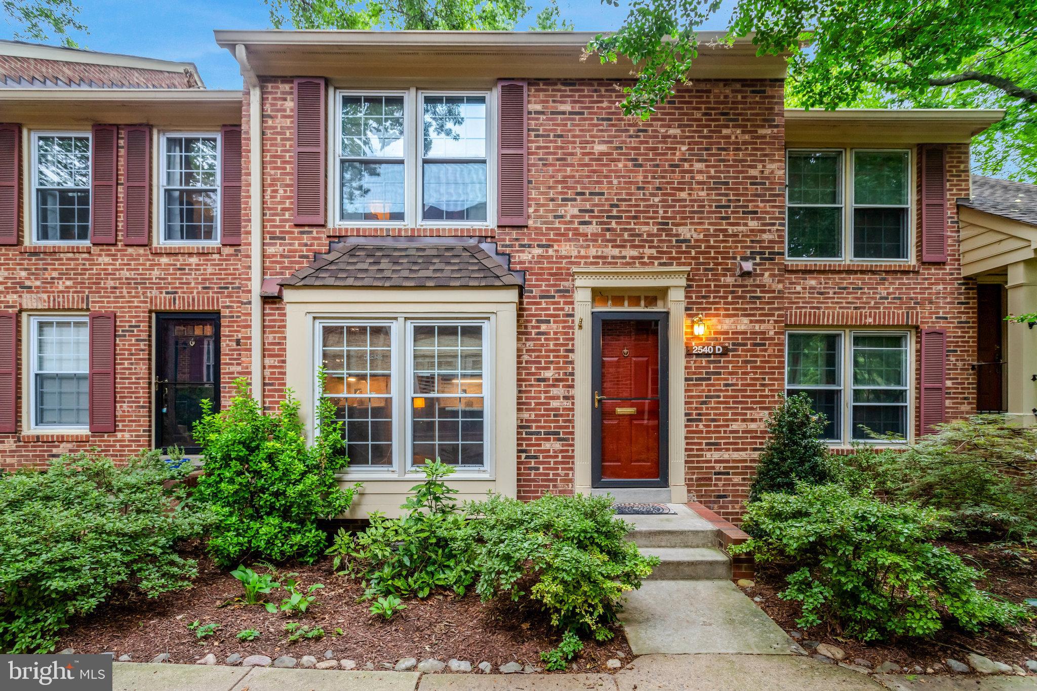 2540 South Walter Reed Drive, Unit 4 Arlington, VA 22206 - Photo 2 of 40 front view of a brick house with a large windows
