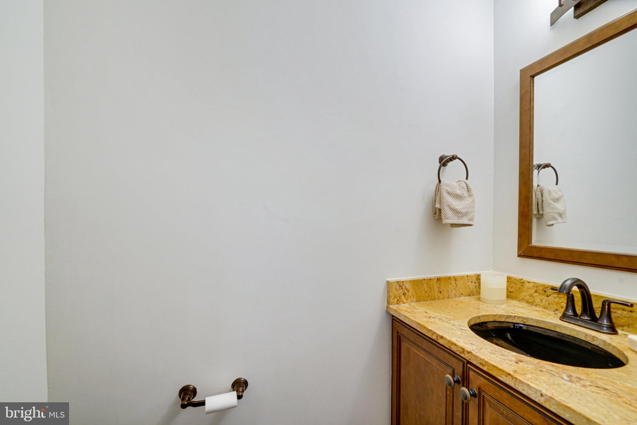 2540 South Walter Reed Drive, Unit 4 Arlington, VA 22206 - Photo 21 of 40 a bathroom with a sink and vanity