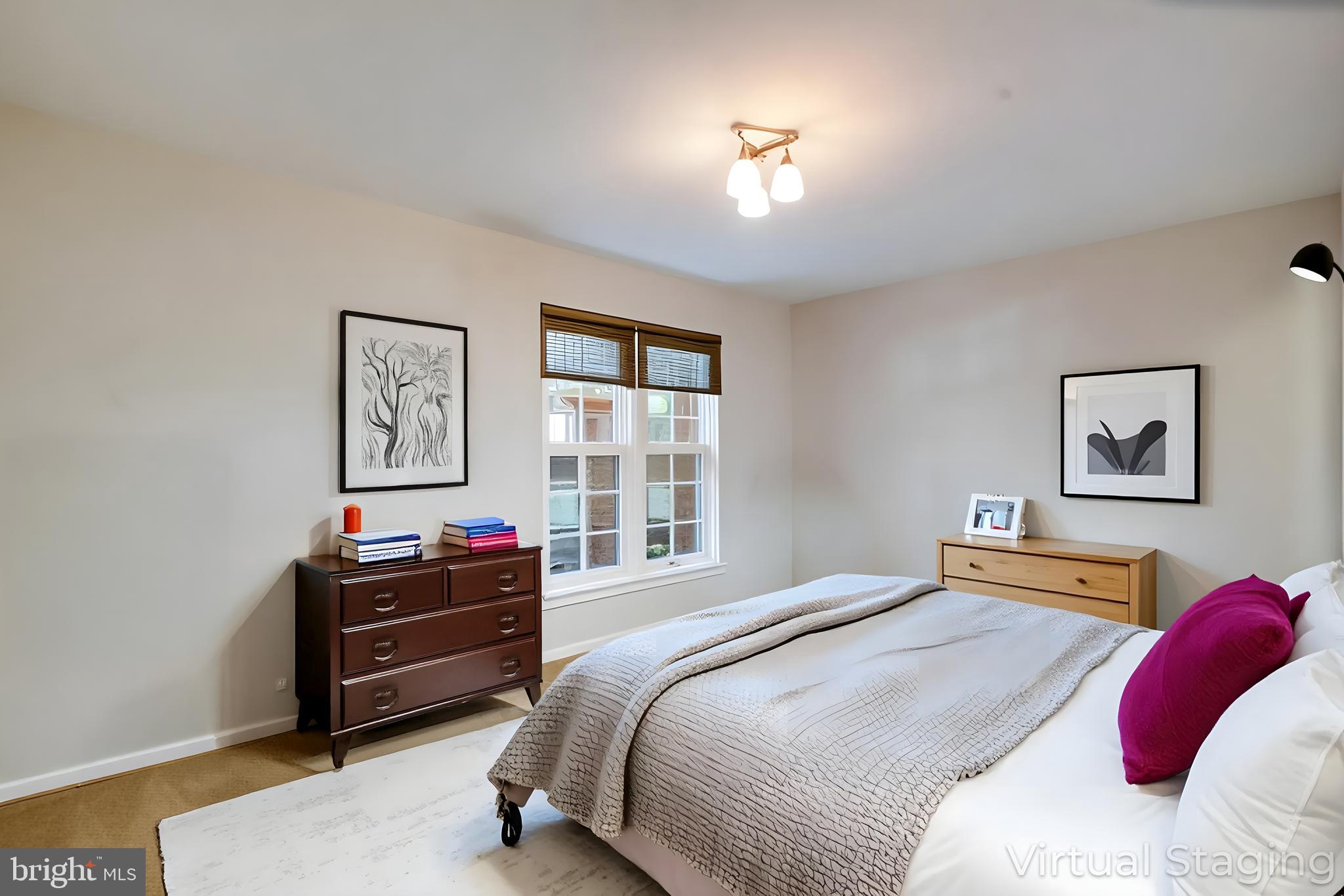 2540 South Walter Reed Drive, Unit 4 Arlington, VA 22206 - Photo 22 of 40 a bedroom with a bed and a chandelier