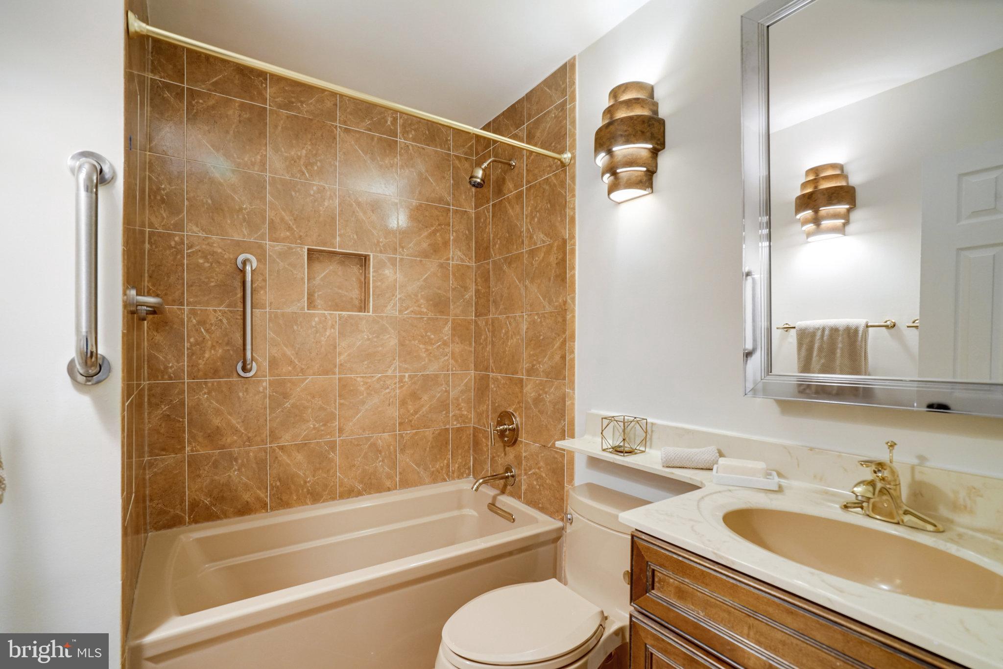 2540 South Walter Reed Drive, Unit 4 Arlington, VA 22206 - Photo 27 of 40 a bathroom with a sink and a mirror