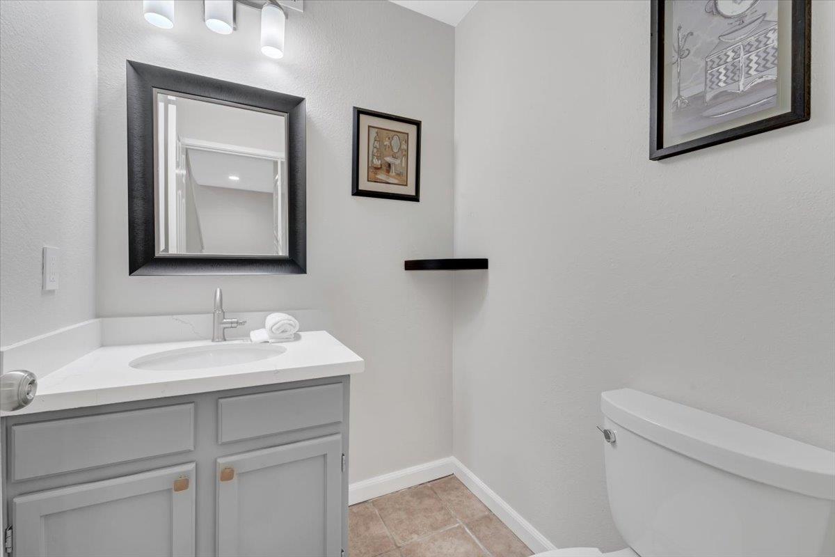 244 Rachael Place Pleasanton, CA 94566 - Photo 11 of 24 a bathroom with a toilet sink and mirror