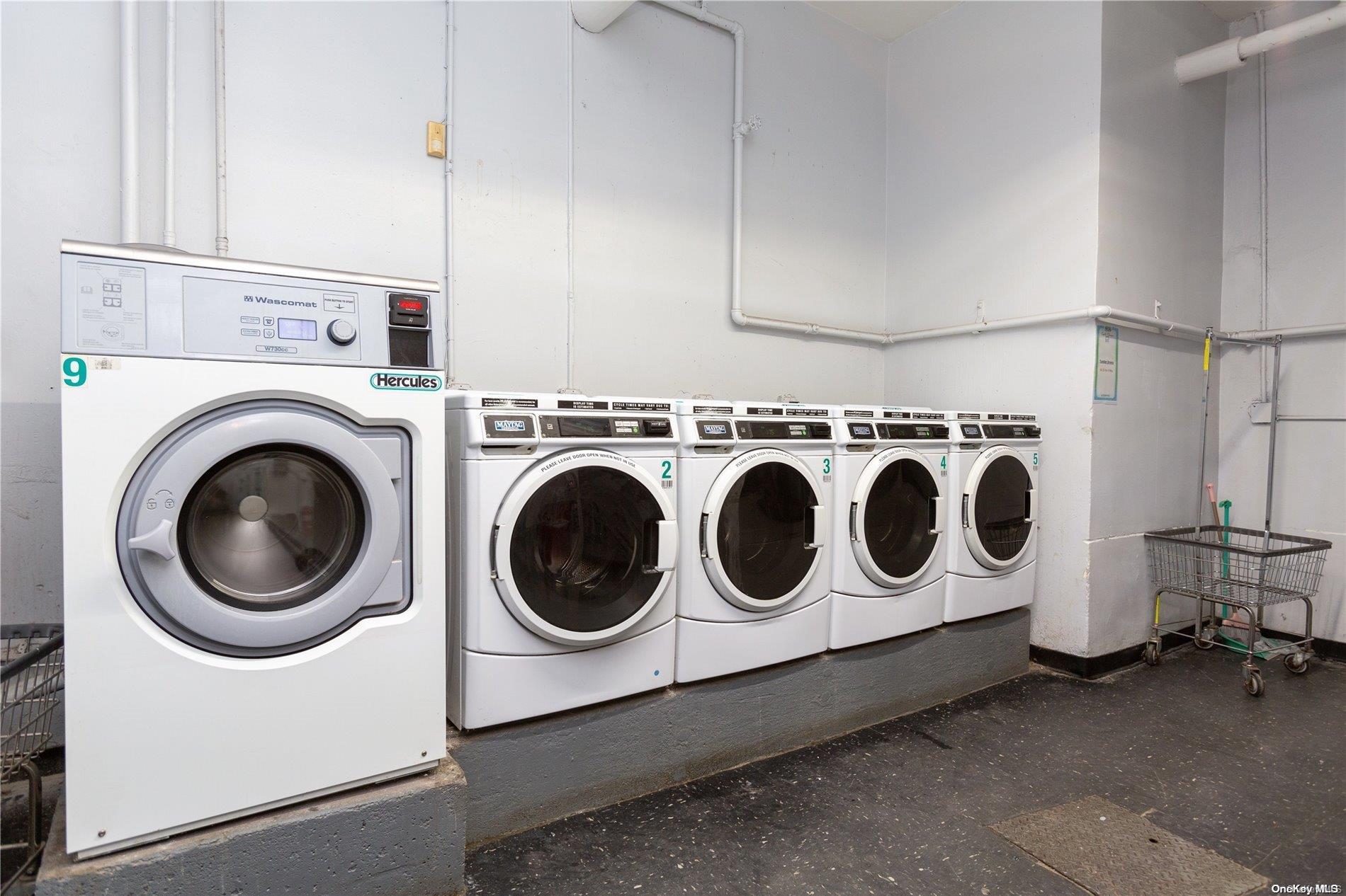 41-07 Bowne Street, Unit 3K Queens, NY 11355 - Photo 14 of 17 a utility room with dryer and washer