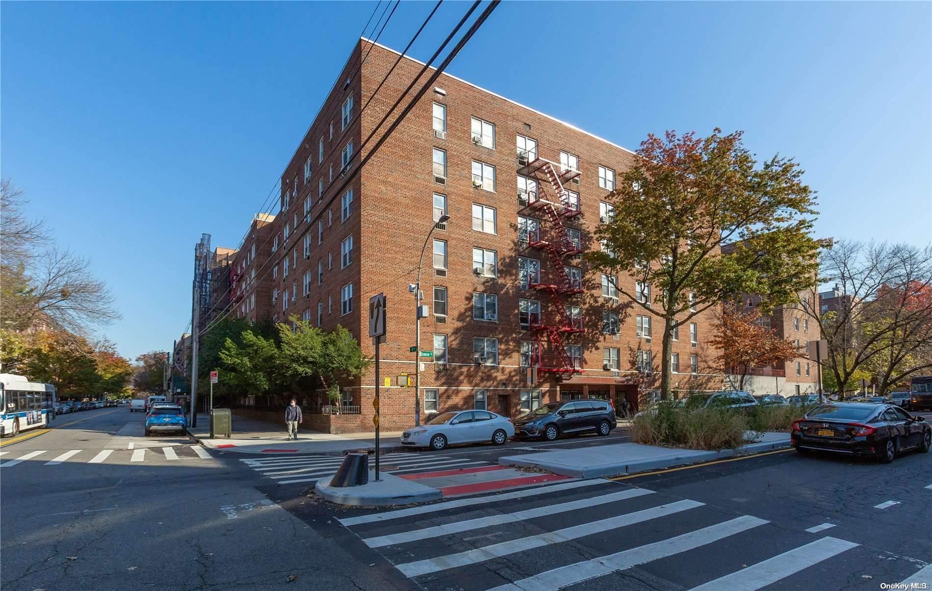 41-07 Bowne Street, Unit 3K Queens, NY 11355 - Photo 2 of 17 a view of street with parked cars