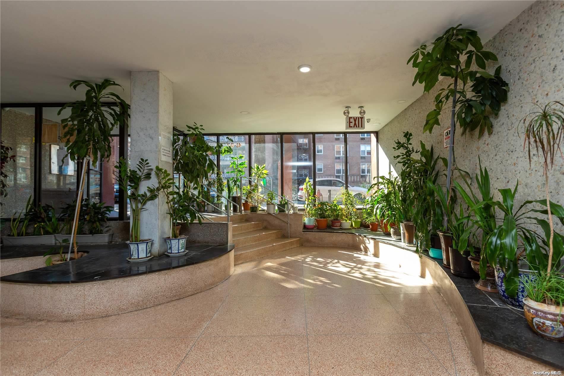 41-07 Bowne Street, Unit 3K Queens, NY 11355 - Photo 5 of 17 a view of a house with a patio