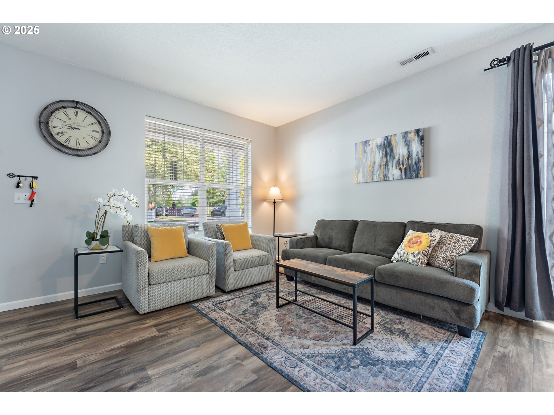 6255 Southwest 182nd Terrace Beaverton, OR 97007 - Photo 11 of 42 a living room with furniture and a large window